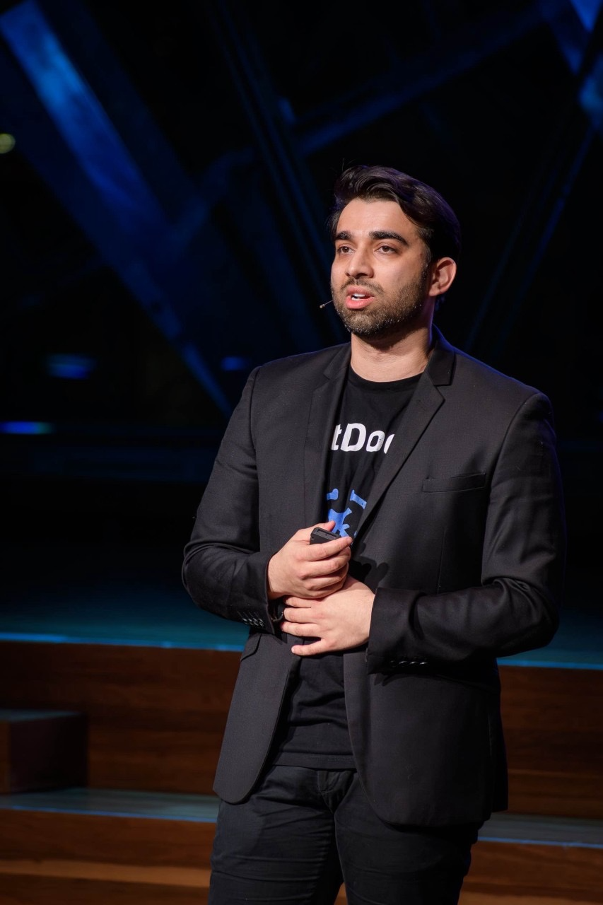 Dr Anurag Ganugapati speaking at a healthcare conference